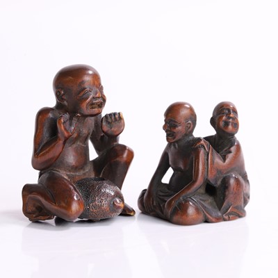 Lot 394 - Two Japanese wood netsuke