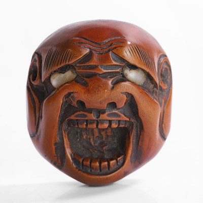 Lot 272 - A Japanese boxwood mask netsuke