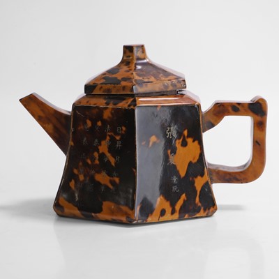 Lot 150 - An unusual Chinese Yixing tortoiseshell-veneered stoneware teapot and cover