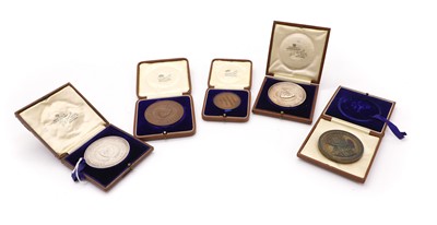 Lot 314 - A collection of five Oxford University sports medallions, awarded to R D Clarke