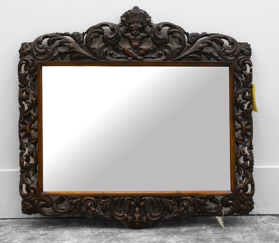 Lot 491 - A carved oak wall mirror