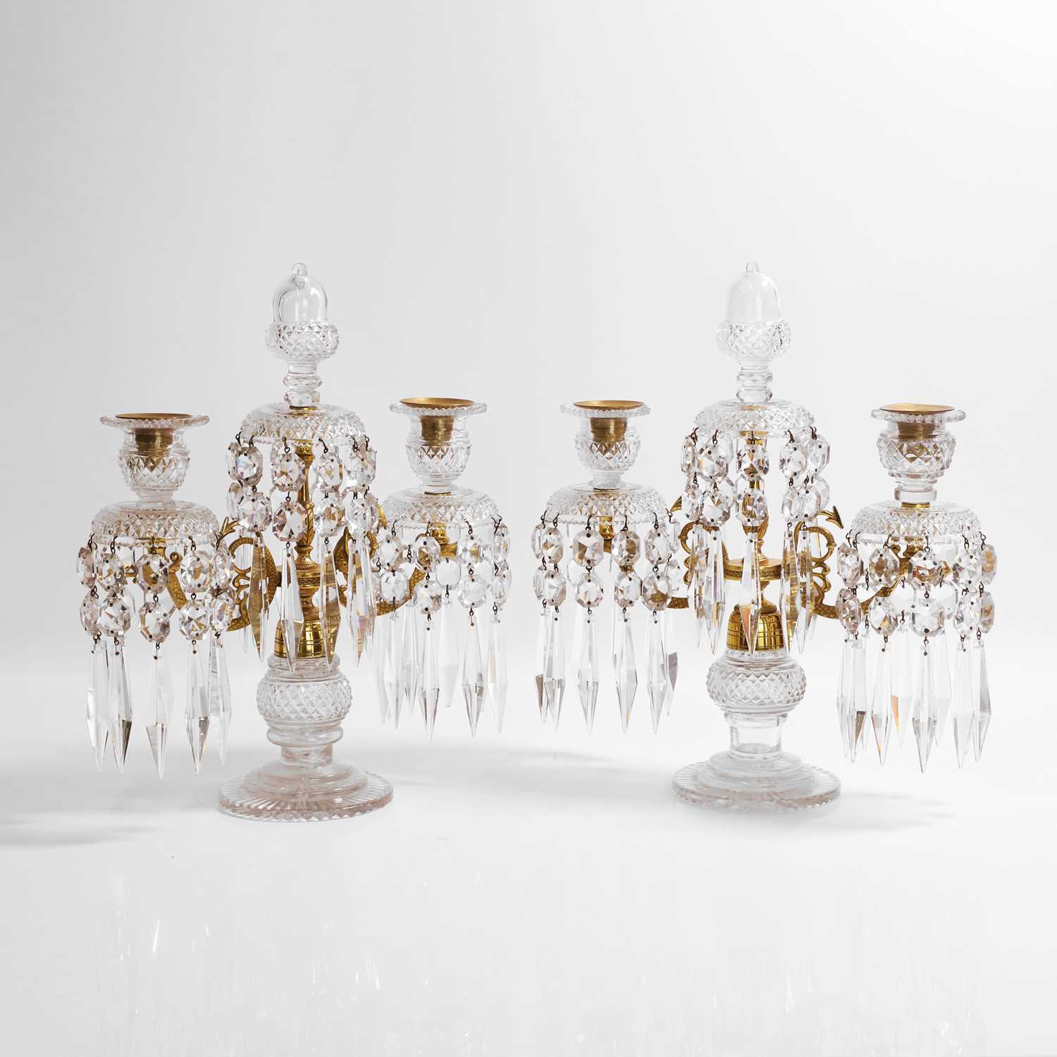 Lot 34 - A pair of Regency cut-glass and gilt-metal candelabra