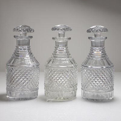 Lot 154 - A set of three Regency cut glass decanters