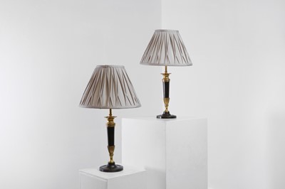 Lot 127 - A pair of Empire-style gilt and patinated bronze lamps