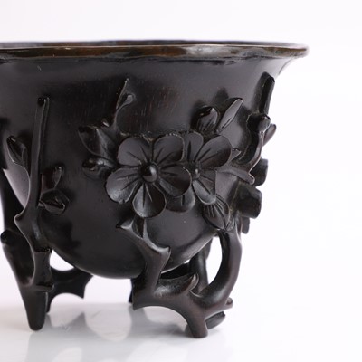 Lot 121 - A Chinese wood libation cup