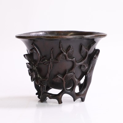 Lot 121 - A Chinese wood libation cup