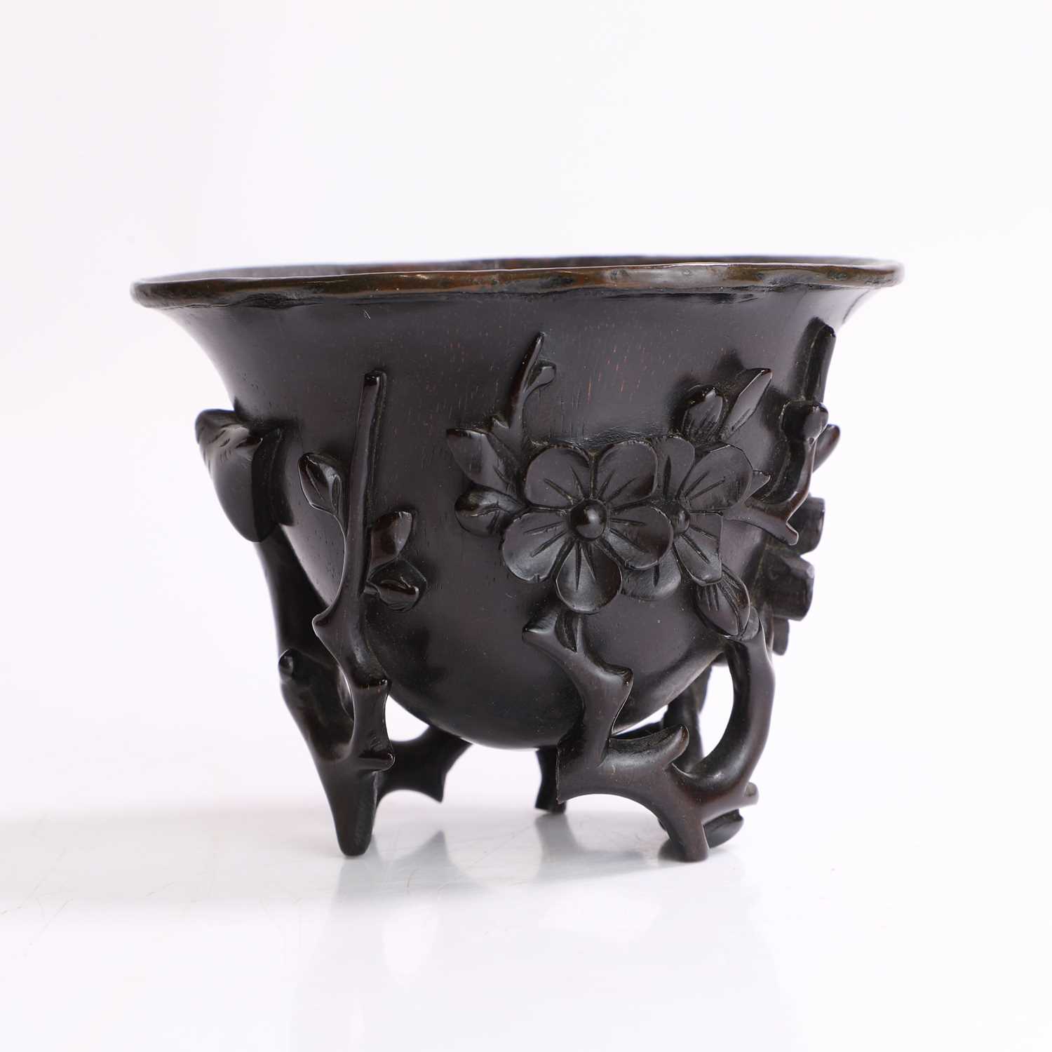 Lot 121 - A Chinese wood libation cup