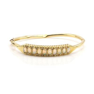 Lot 1106 - An 18ct gold opal and diamond hinged bangle