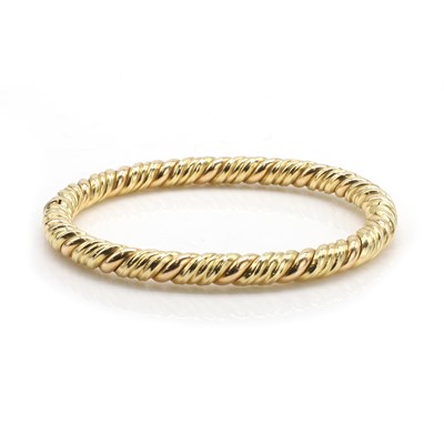 Lot 188 - An 18ct gold hinged bangle