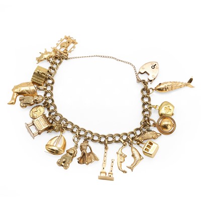 Lot 1258 - A gold charm bracelet