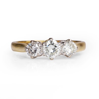Lot 1061 - An 18ct gold diamond three stone ring