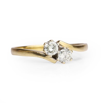 Lot 1038 - An 18ct gold diamond two stone ring