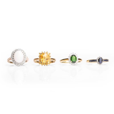 Lot 1184 - A group of four 9ct gold diamond and gemstone set rings