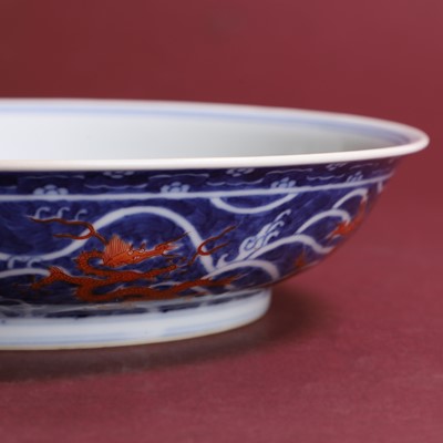 Lot 70 - A Chinese iron-red and underglaze blue dish
