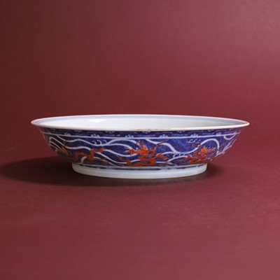 Lot 70 - A Chinese iron-red and underglaze blue dish