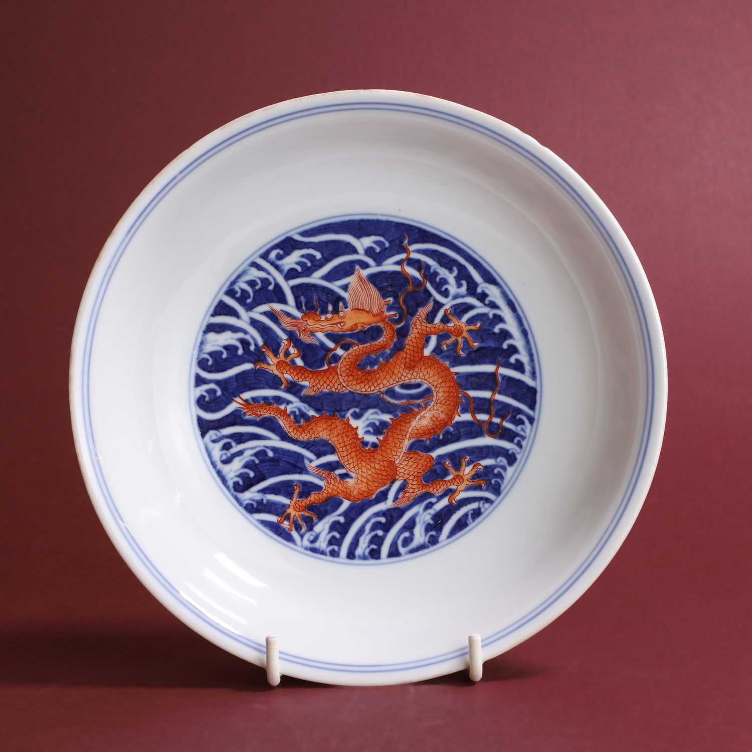 Lot 70 - A Chinese iron-red and underglaze blue dish