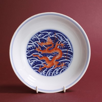 Lot 70 - A Chinese iron-red and underglaze blue dish