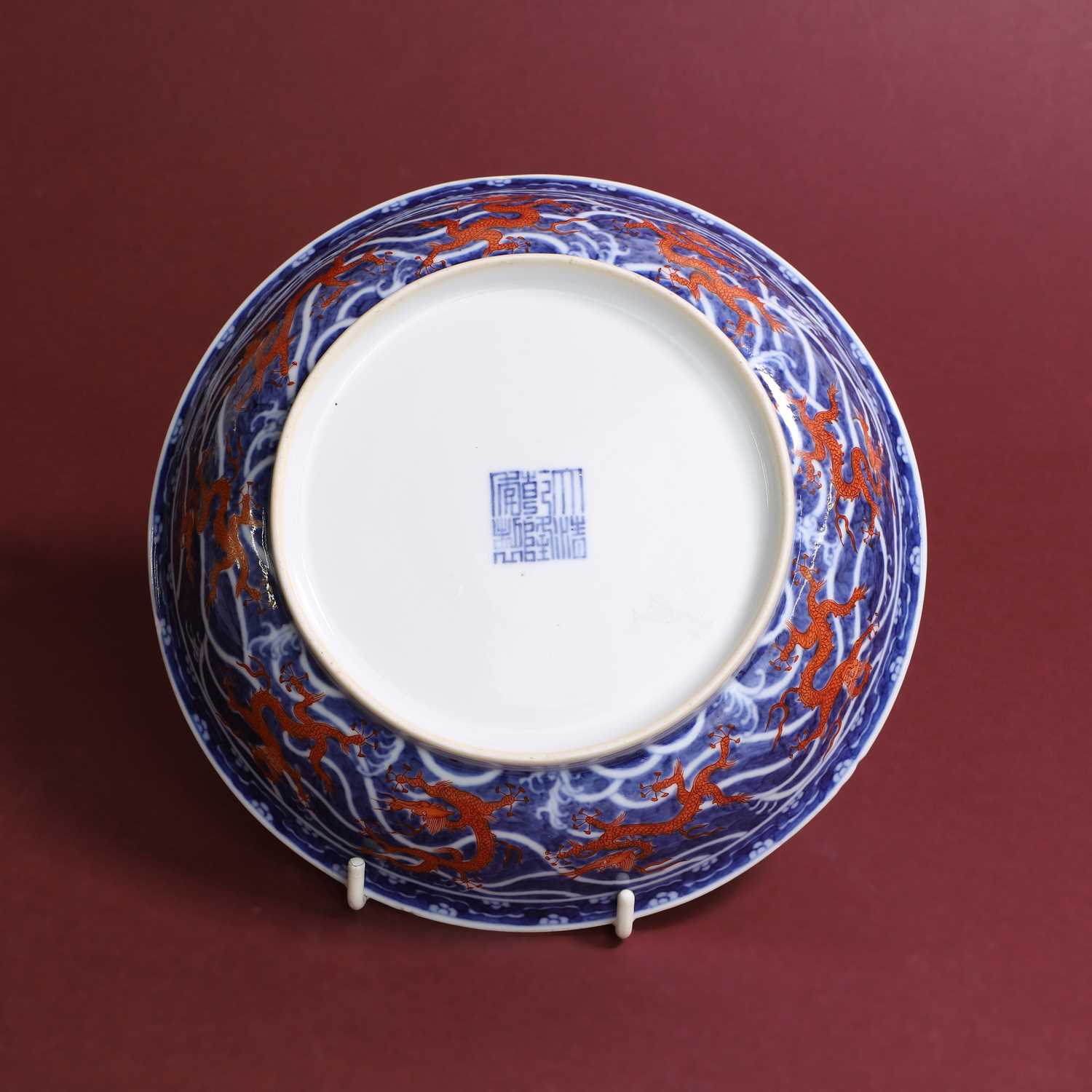 Lot 70 - A Chinese iron-red and underglaze blue dish,