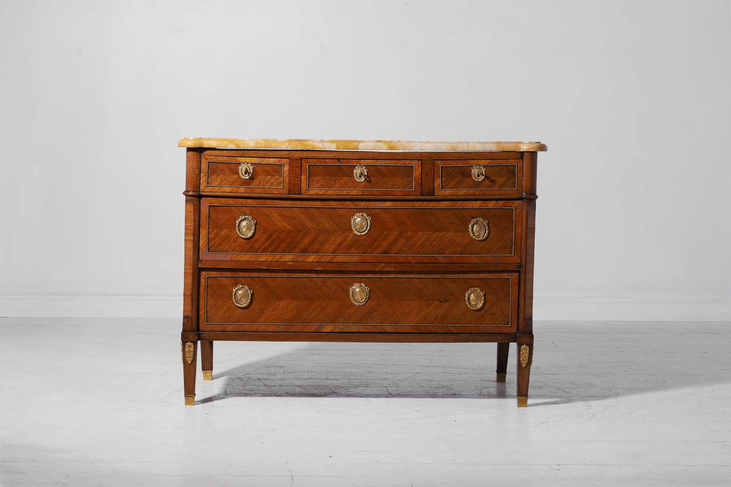 Lot 6 - A Louis XVI mahogany and tulipwood commode