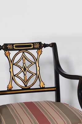 Lot 11 - A set of ten Regency-style black and gilt-painted wooden dining chairs