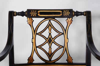 Lot 11 - A set of ten Regency-style black and gilt-painted wooden dining chairs