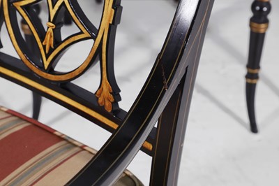 Lot 11 - A set of ten Regency-style black and gilt-painted wooden dining chairs