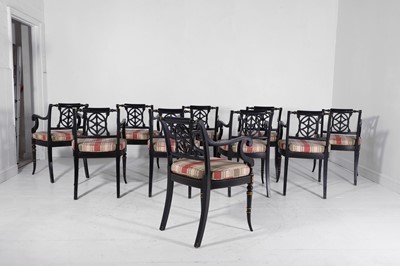 Lot 11 - A set of ten Regency-style black and gilt-painted wooden dining chairs