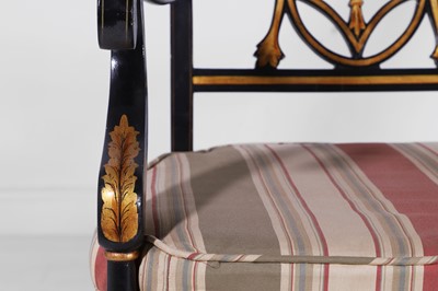 Lot 11 - A set of ten Regency-style black and gilt-painted wooden dining chairs