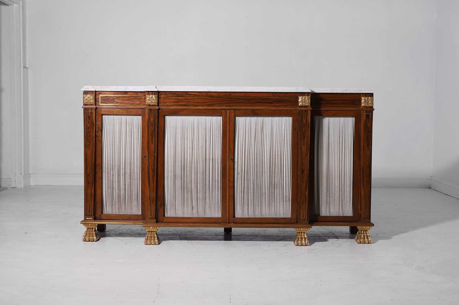 Lot 10 - A Regency-style rosewood and parcel-gilt side cabinet