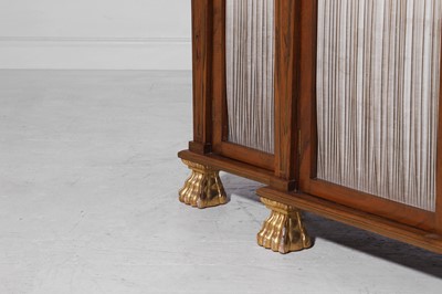 Lot 10 - A Regency-style rosewood and parcel-gilt side cabinet