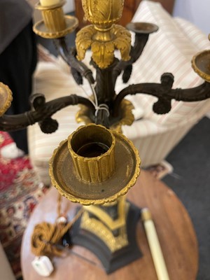 Lot 4 - A pair of large Empire-style gilt and patinated bronze candelabras