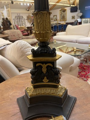 Lot 4 - A pair of large Empire-style gilt and patinated bronze candelabras