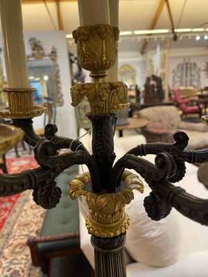 Lot 4 - A pair of large Empire-style gilt and patinated bronze candelabras