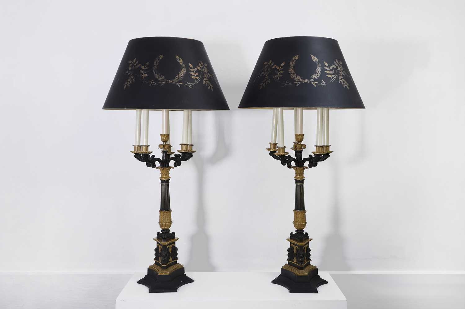 Lot 4 - A pair of large Empire-style gilt and patinated bronze candelabras