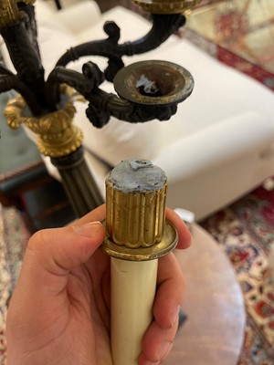 Lot 4 - A pair of large Empire-style gilt and patinated bronze candelabras