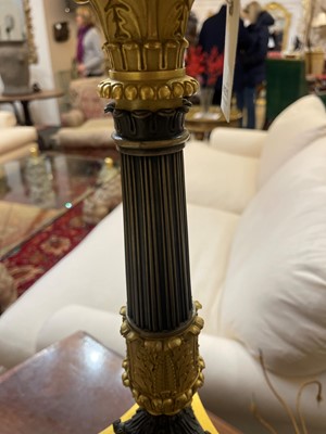 Lot 4 - A pair of large Empire-style gilt and patinated bronze candelabras