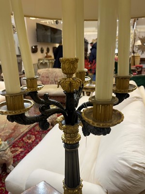 Lot 4 - A pair of large Empire-style gilt and patinated bronze candelabras