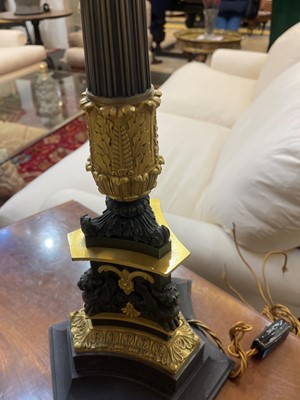 Lot 4 - A pair of large Empire-style gilt and patinated bronze candelabras