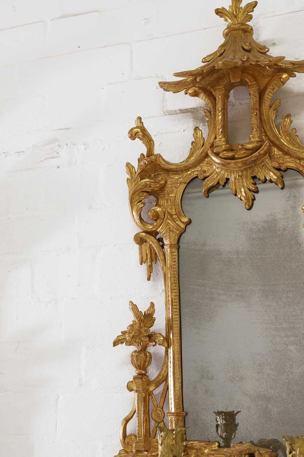 Lot 15 - A pair of George III-style carved giltwood girandoles in the Chippendale taste