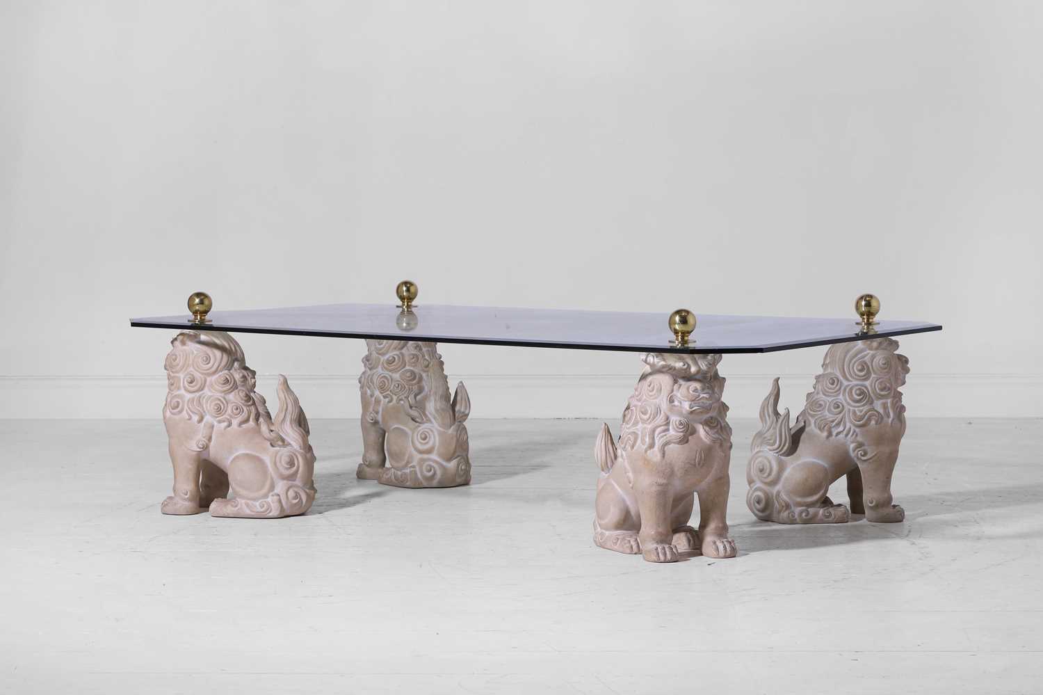 Lot 3 - A glass and composition coffee table