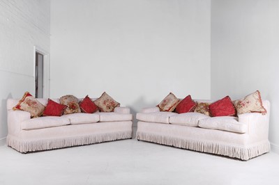 Lot 1 - A pair of upholstered three-seater sofas