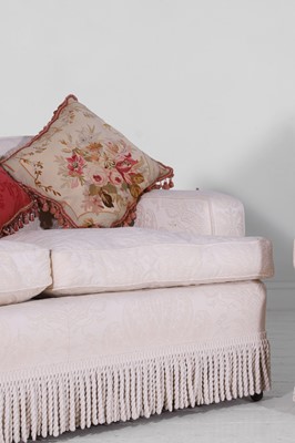 Lot 1 - A pair of upholstered three-seater sofas