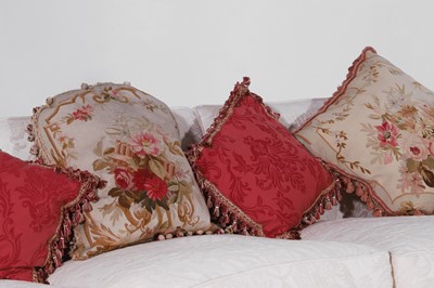 Lot 1 - A pair of upholstered three-seater sofas