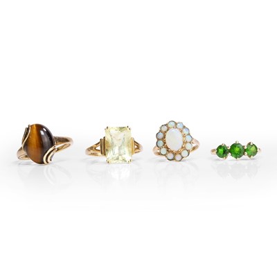 Lot 1186 - A group of four 9ct gold gemstone set rings