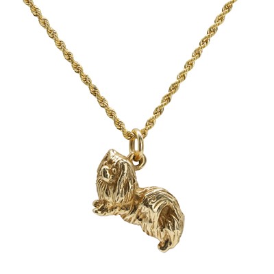 Lot 1068 - A 9ct gold dog pendant
