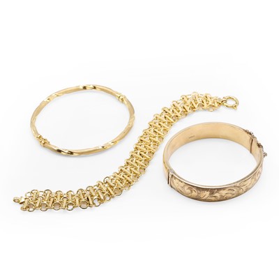 Lot 1206 - A group of three gold bracelets