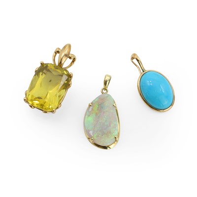 Lot 1174 - A group of three gemstone set pendants