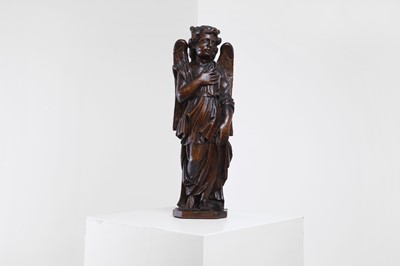 Lot 118 - A baroque carved walnut angel