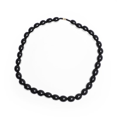 Lot 1150 - A uniform single row jet bead necklace
