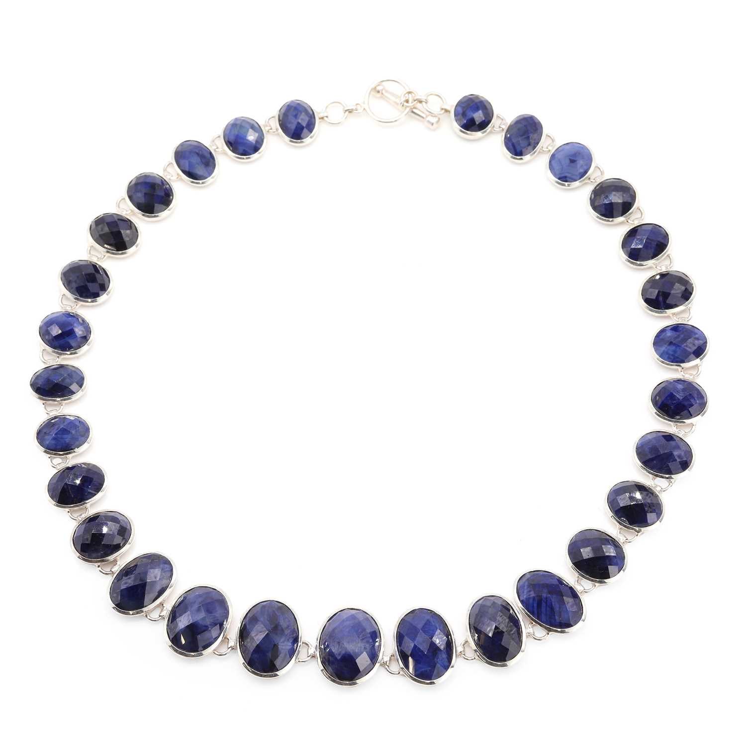 Lot 1124 - A silver sapphire necklace